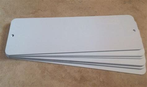 white aluminum signs